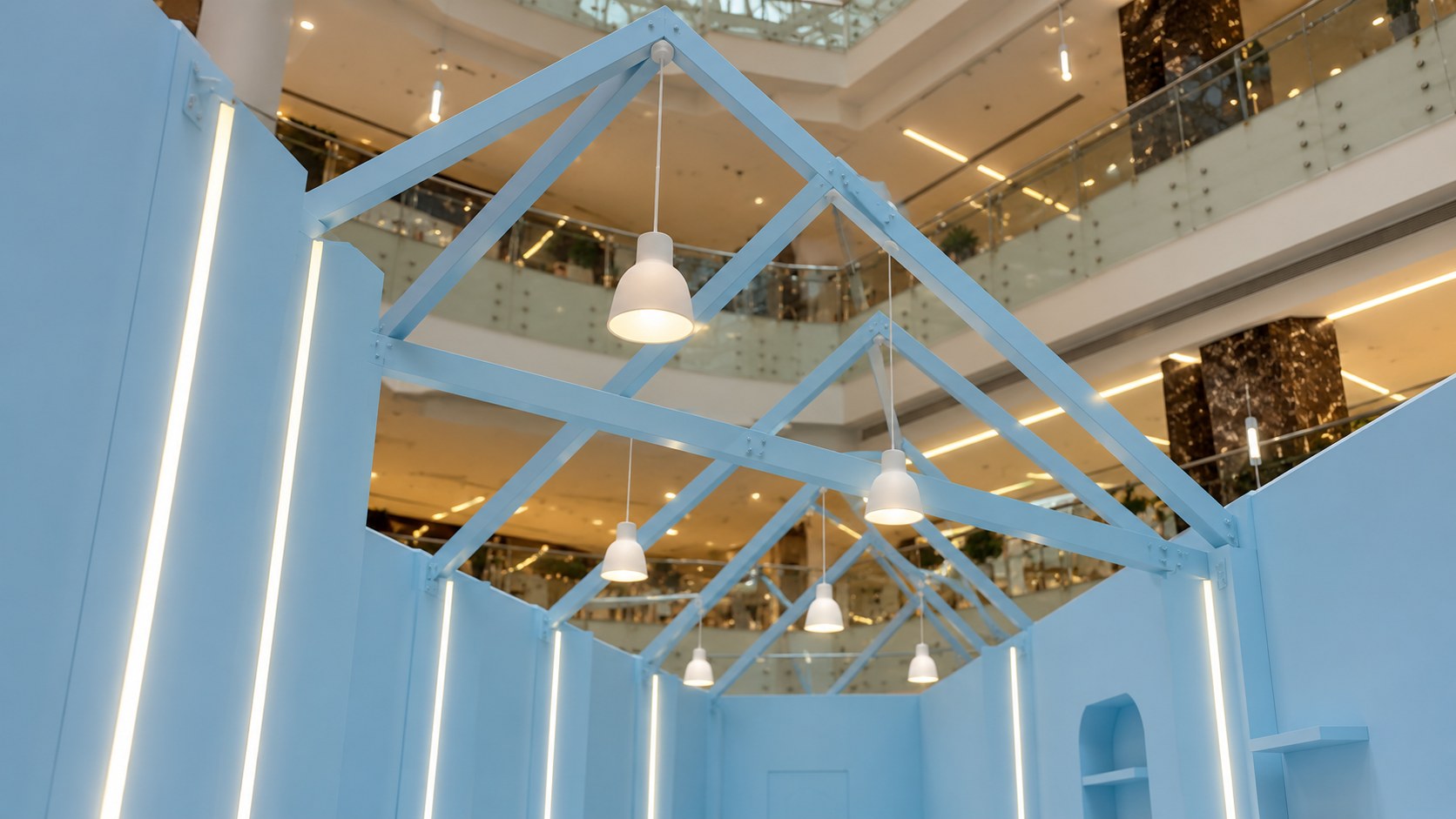 Anasala Exhibition — Pale-Blue Roof Trusses and Pendant Lights