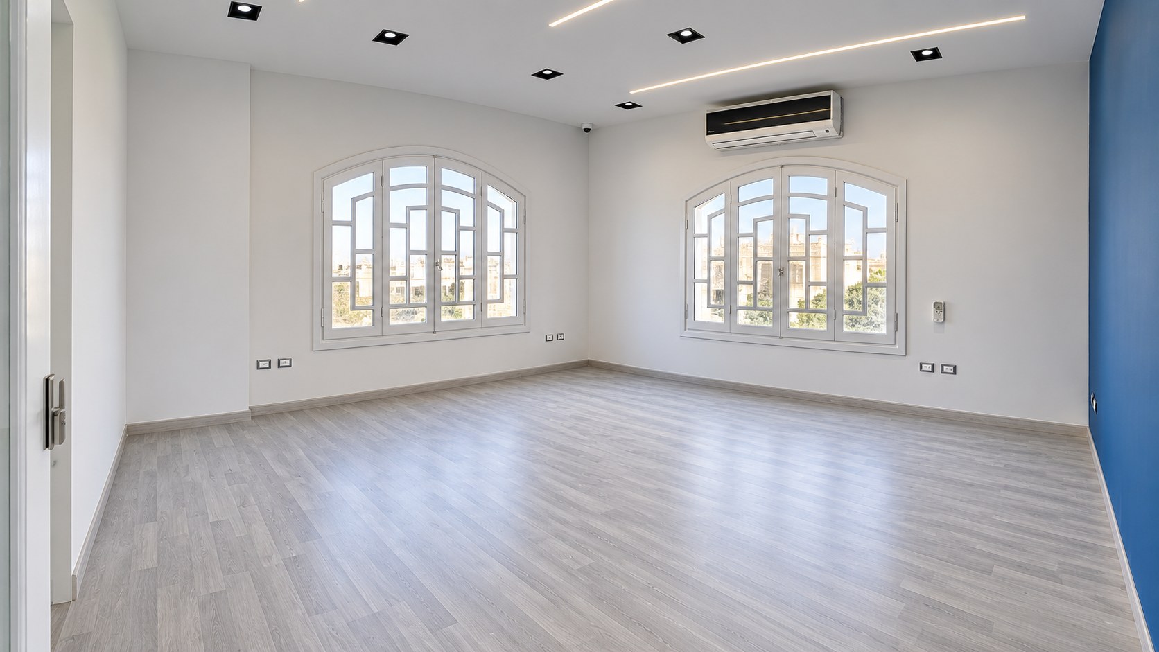 Raad Team gaming house — Finished BME Media Room with Arched Windows